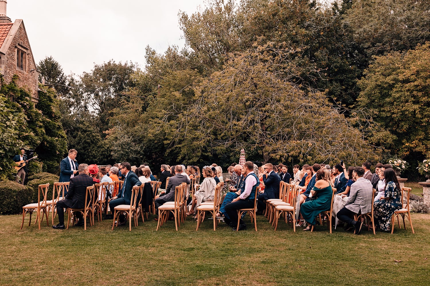 Guests waiting for the arrival of the bride at an outdoor wedding ceremony in Yorkshire