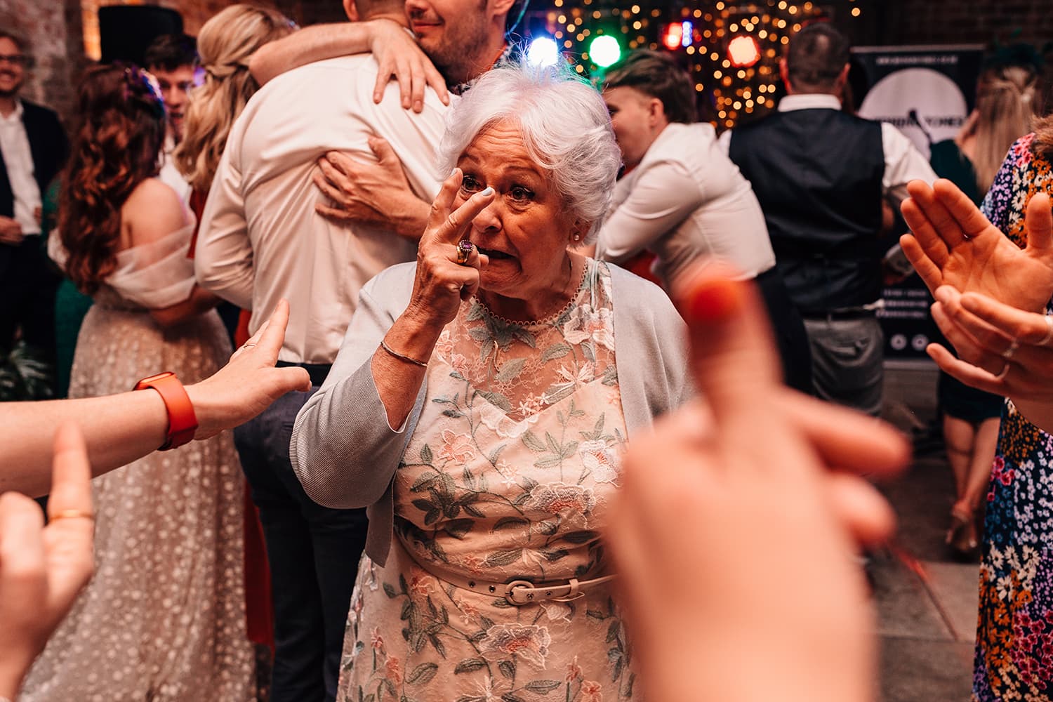 Fun wedding photograph of wedding guest partying